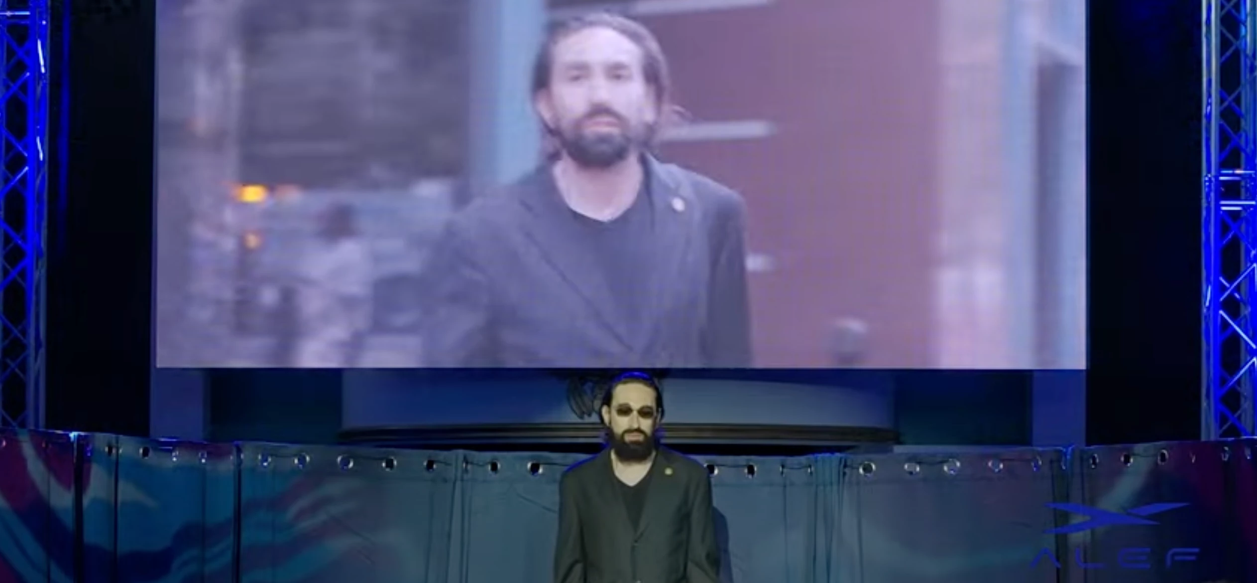 Jim Dukhovny, CEO of Alef, poses with a video of himself