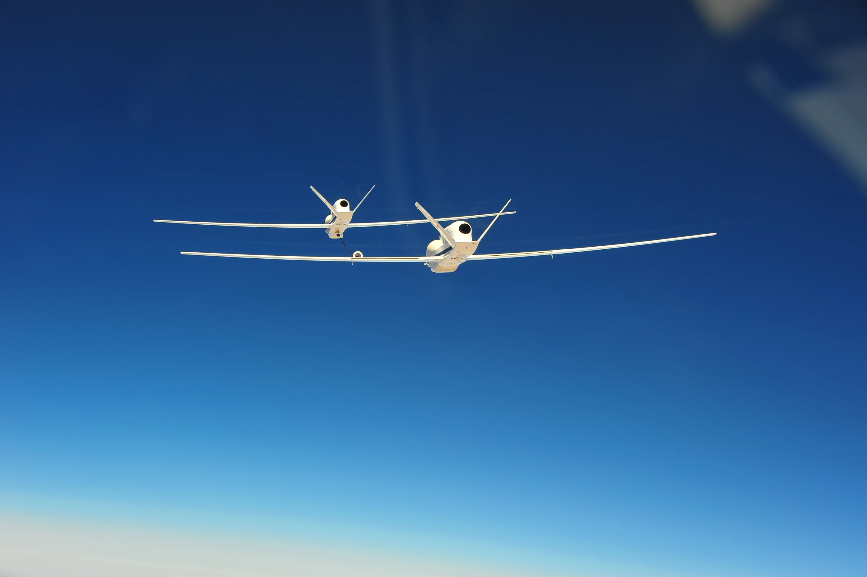 The two NASA Global Hawk UAVs flew in close formation in a series of flights earlier this year