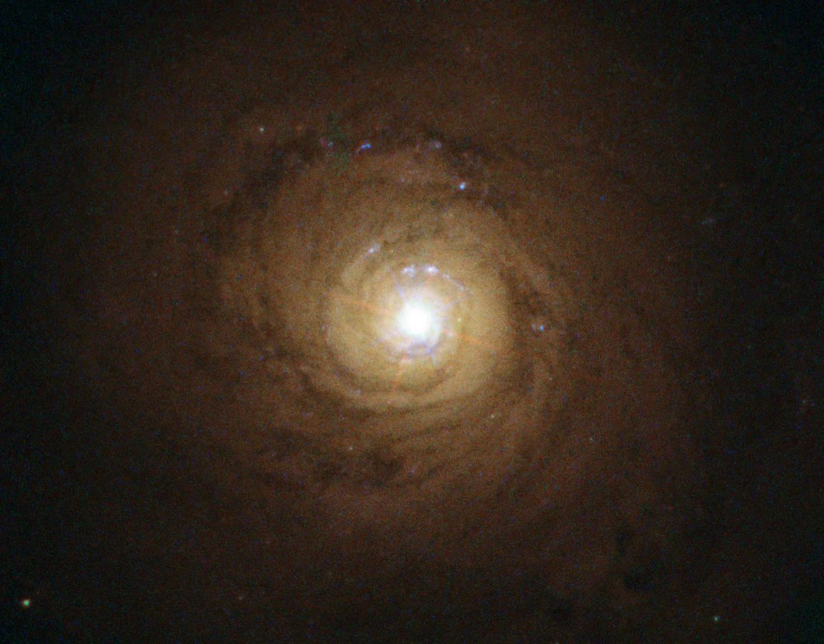 This is the galaxy known as NGC 5548. At its heart, though not visible here, is a supermassive black hole behaving in a strange and unexpected manner