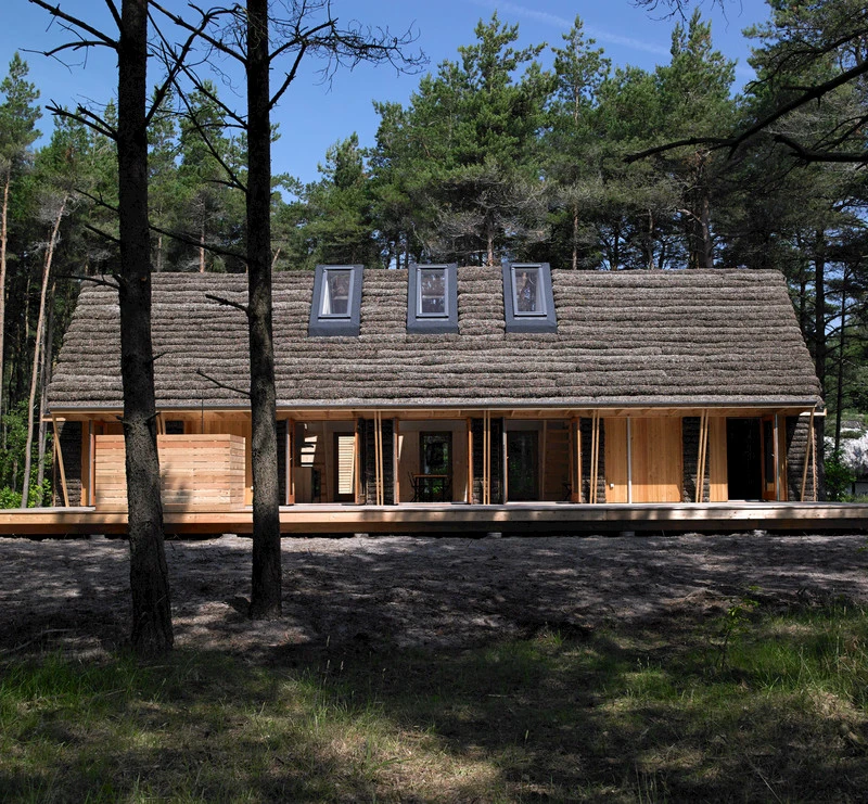 Located on the small island of Læso in Denmark, The Modern Seaweed House features a unique seaweed roof