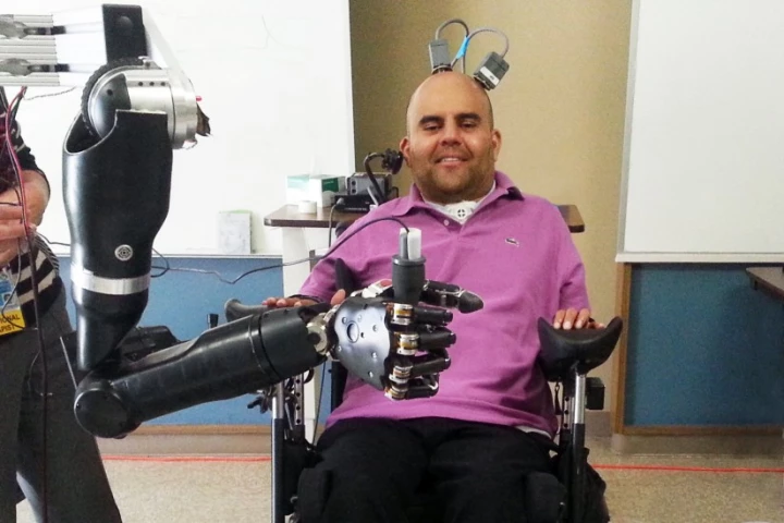 Erik G. Sorto controls the "mind-reading" robotic arm