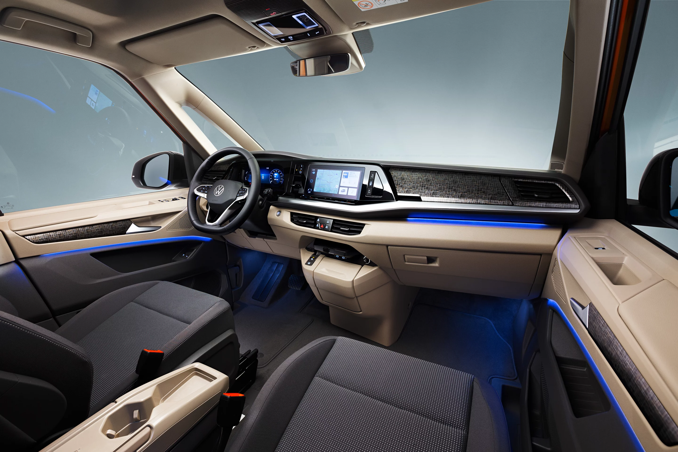 Volkswagen eliminated the manual transmission and made the parking brake a button to free up the space between the front seats for the multifunctional table/console