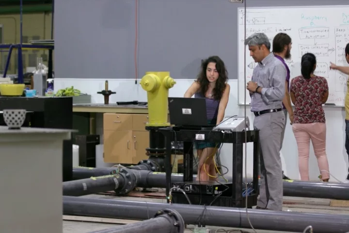 The lab-testing setup for the system, which consists of PVC pipes and a sensor-equipped fire hydrant