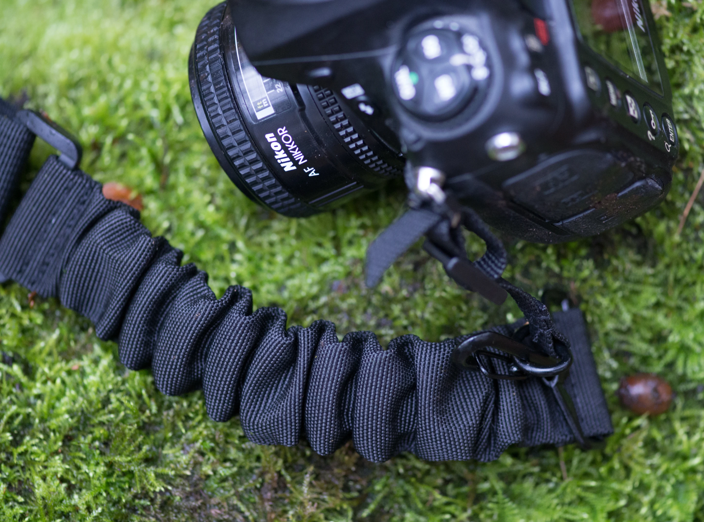 The Boomr camera strap uses built-in bungee cords to act as shock absorbers