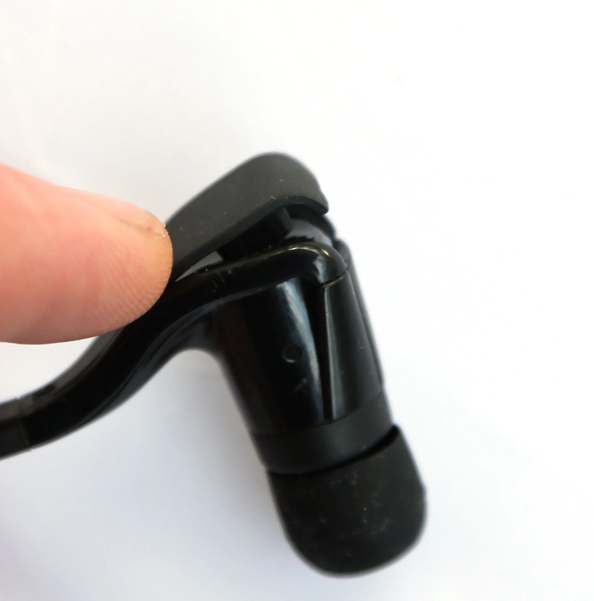 Charging is via a mini USB port concealed at the back of one of the buds (Photo: Gizmag)