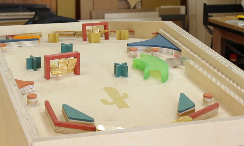 The frame and obstacle elements are made from plywood, MDF, acrylic and aluminum