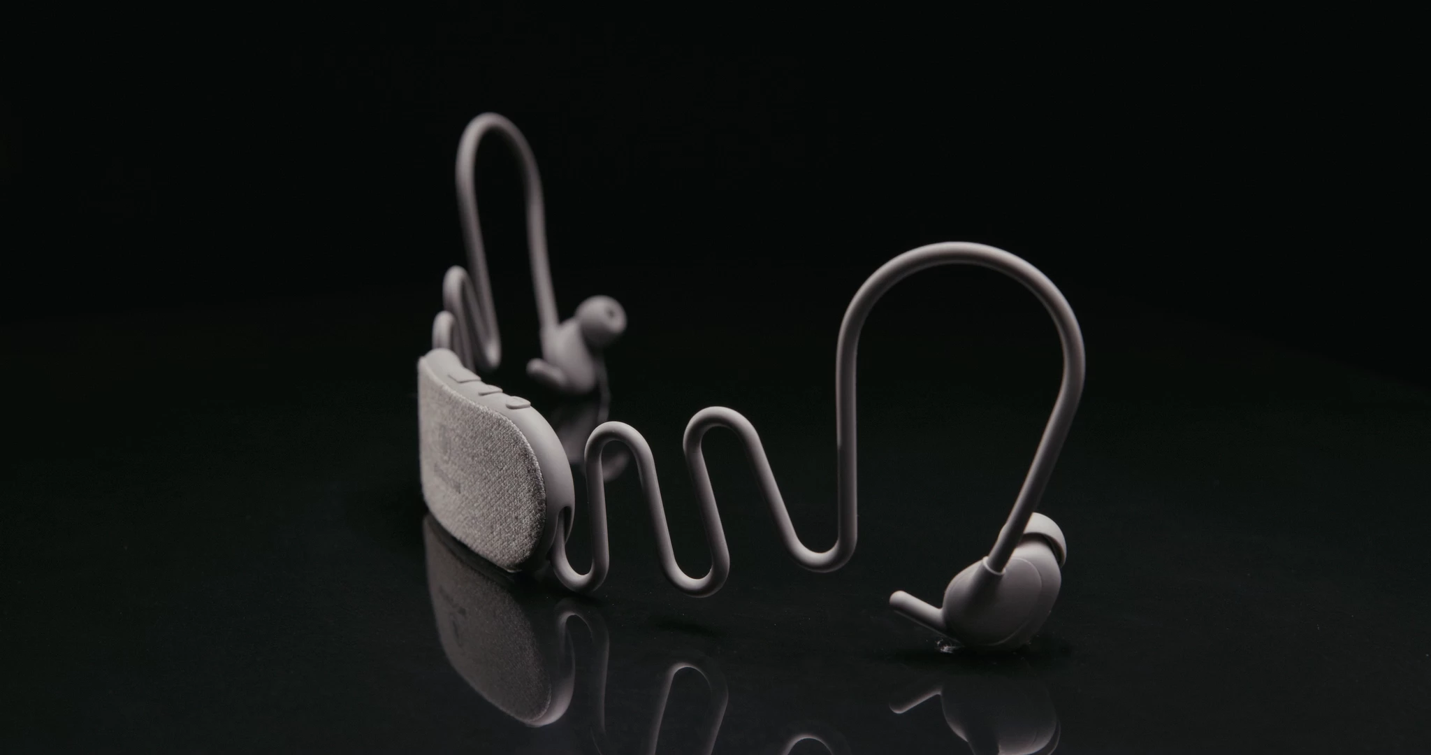 Battery and controls are relegated to the back of your head so the earbuds themselves can be as small as possible