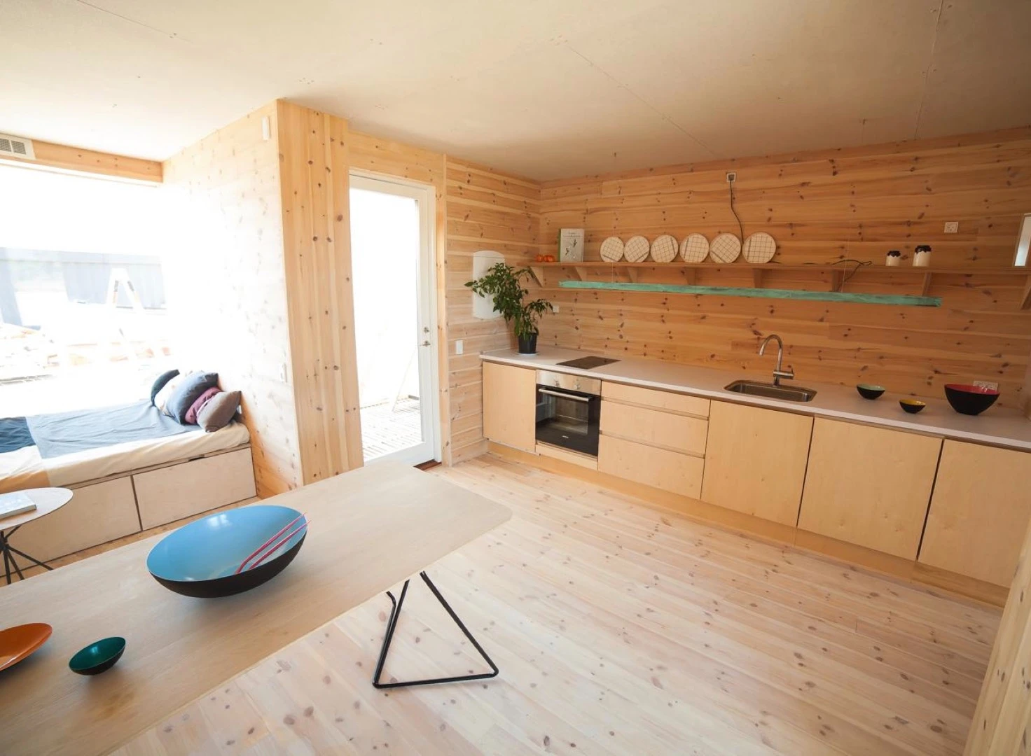 The walls and floor are clad in sustainably-forested Swedish pine