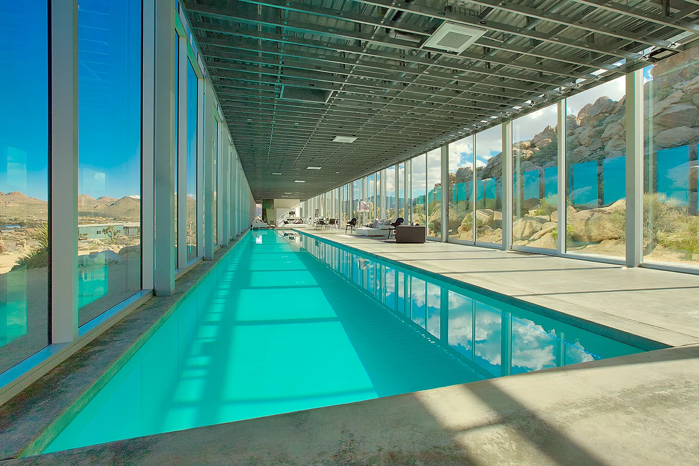 The Invisible House has a large pool running most of its length