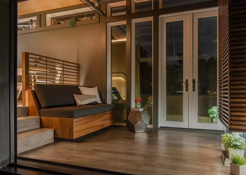 The Orchid Tiny House features a sofa bed