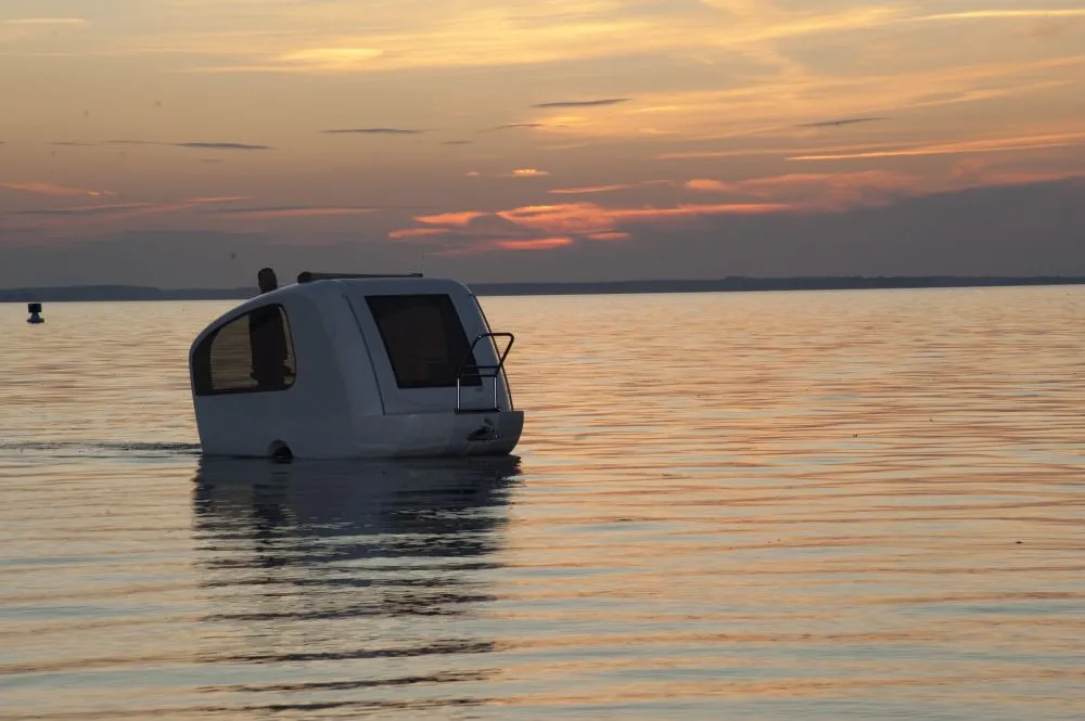 Sealander is a unique vehicle that combines features of an electric motor-powered boat and a camping trailer