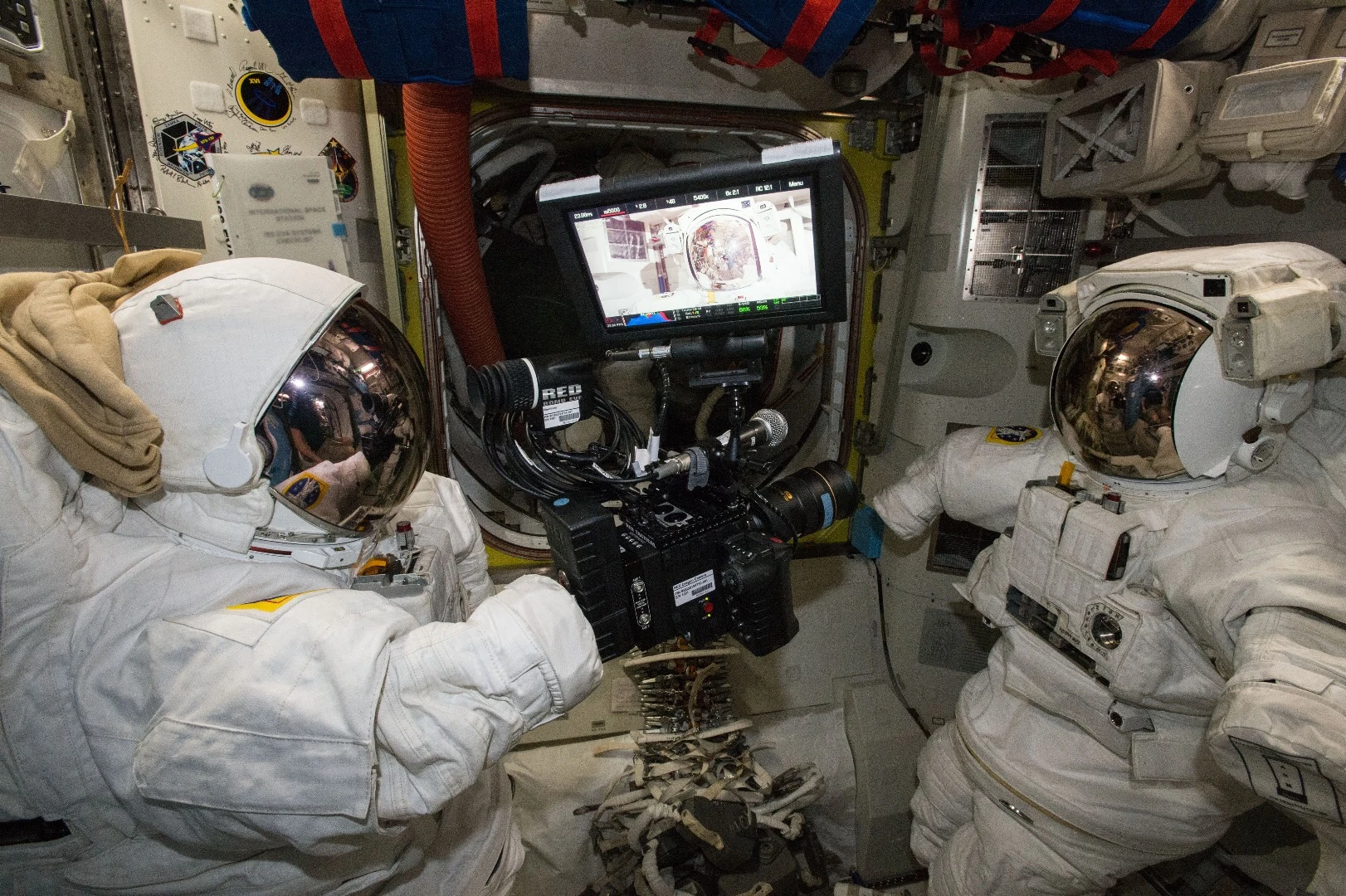 The RED Epic Dragon camera imaged between two NASA ExtraVehicular Mobility Units (EMUs)