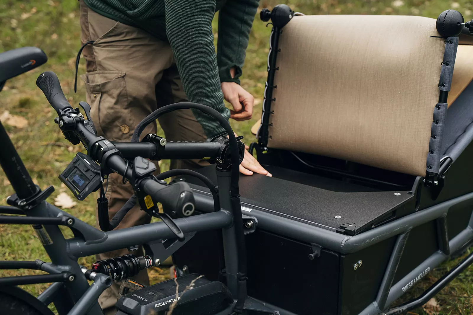 To go from bike to camp mode, the Spacecamper Bike's handlebars fold down, and the lounger/sleeping platform adjusts into position