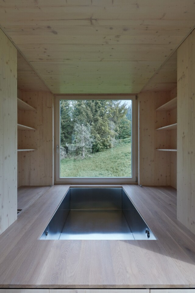 The bed inside the Into the Wild cabin can be raised to reveal a sunken Jacuzzi