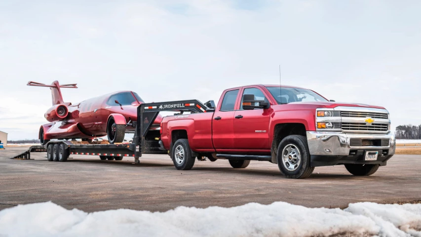 A truck and a trailer are included with the Learmousine