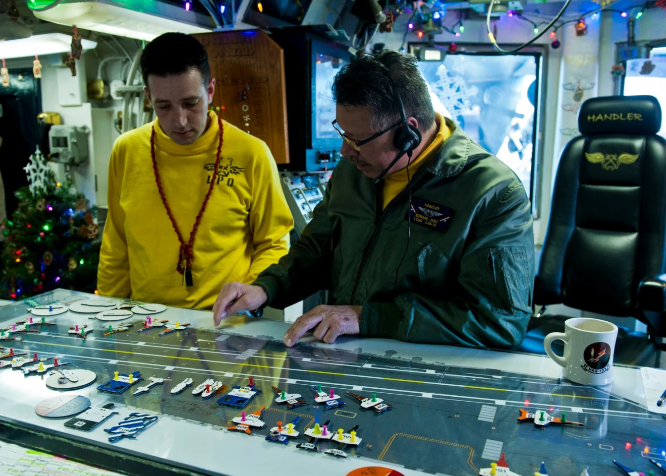 The original "Ouija board" used plastic models of aircraft and other deck items