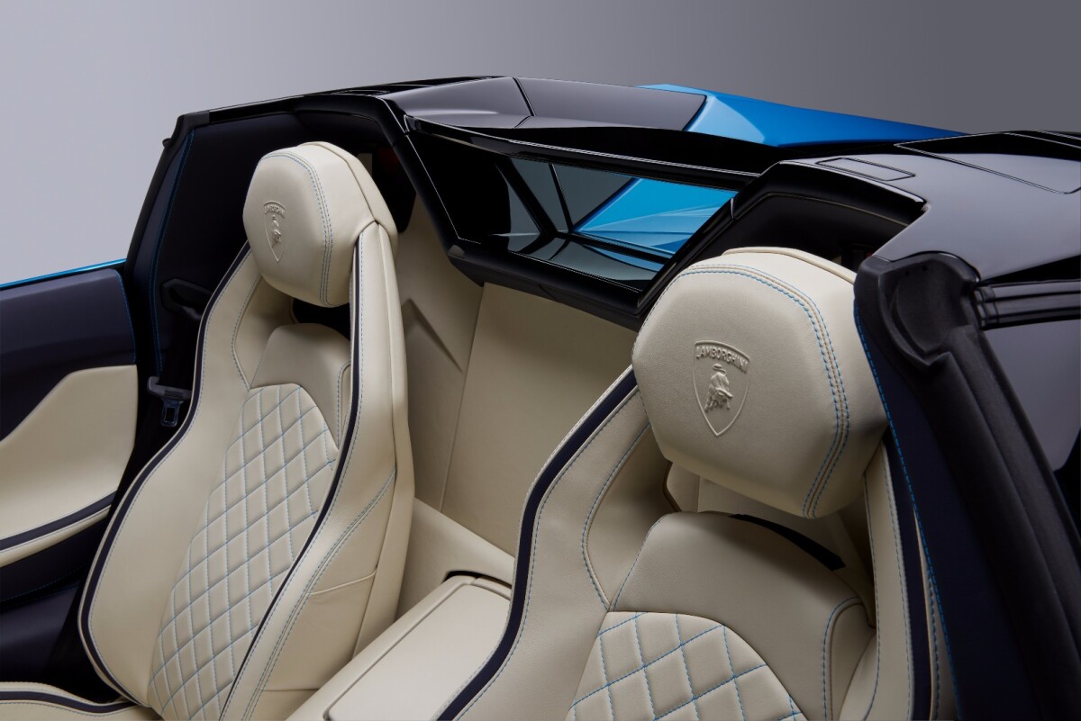 The little window between the seats in the Roadster lets more noise into the cabin