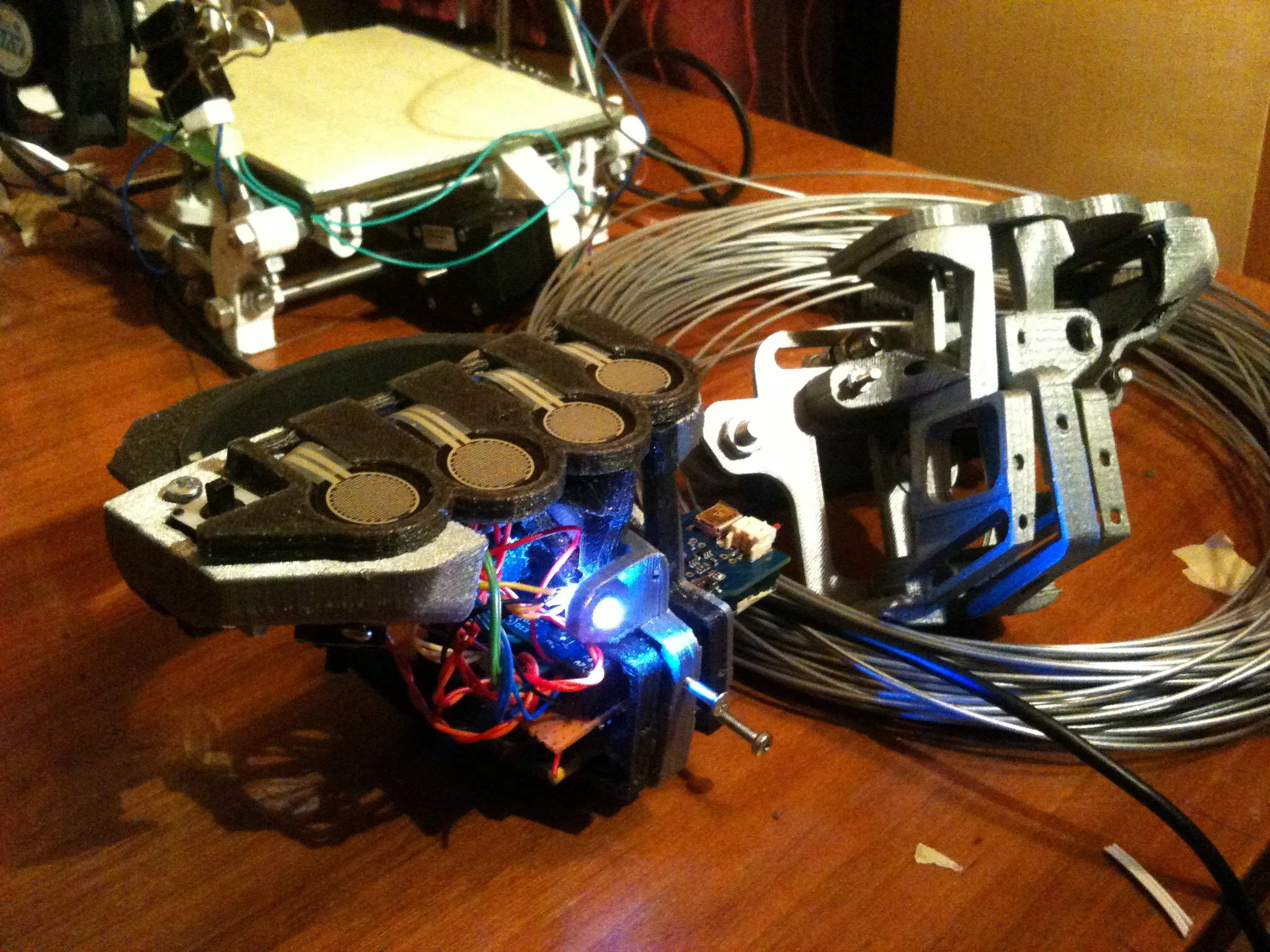 A completed Beatjazz hand controller poses in front of the 3D printer