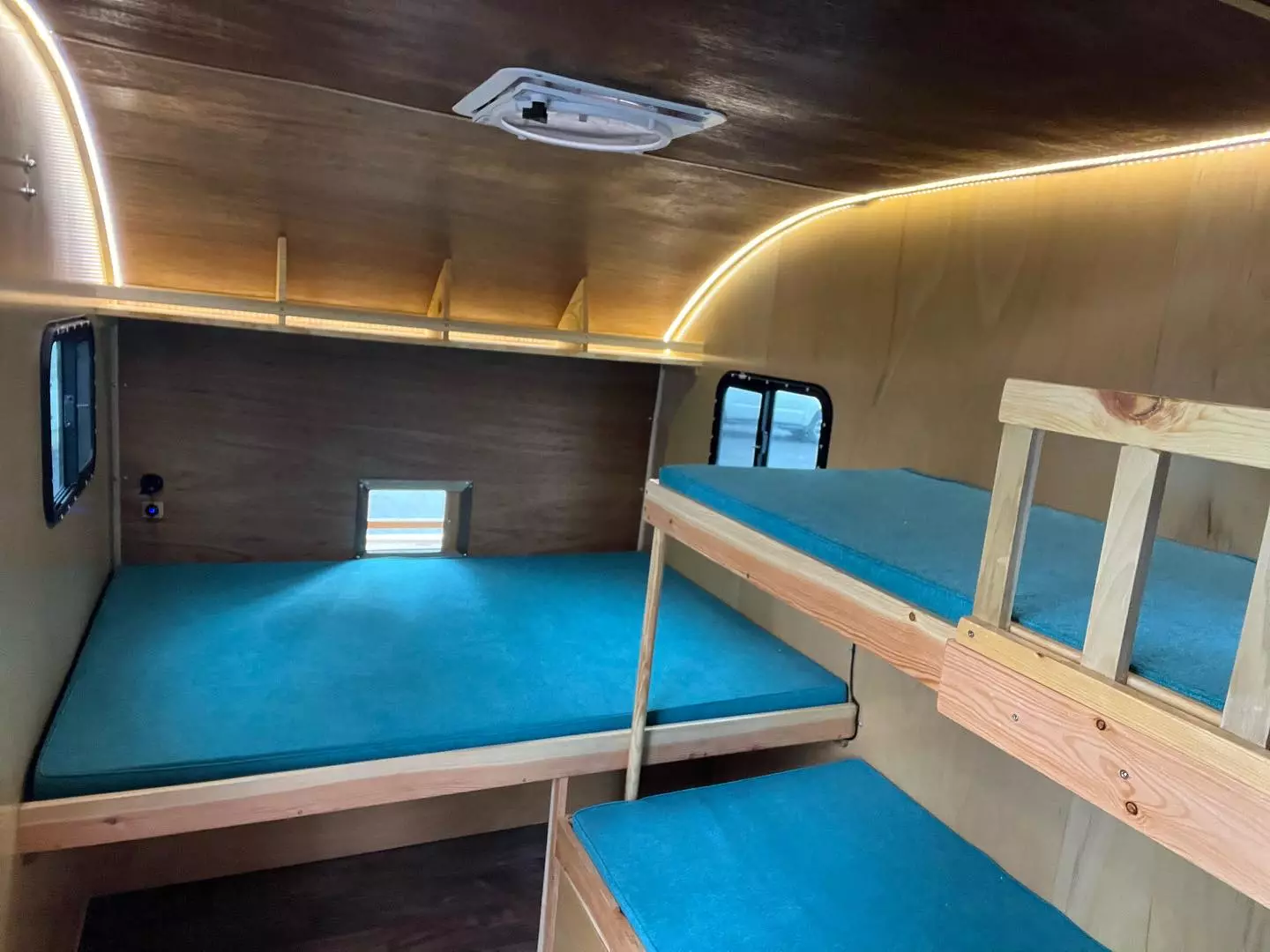 The Tall Boy base floor plan includes a 71 x 54-in double bed and two 70-in-long bunks