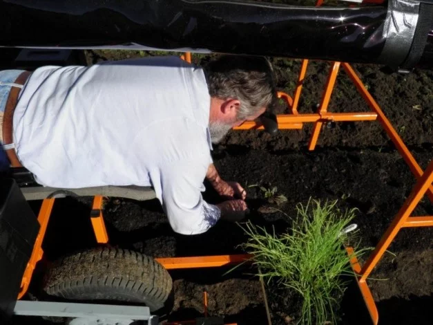 Inventor Brendan Corry demonstrating his Wunda Weeder
