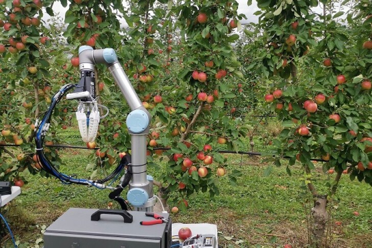 An apple-harvesting robot created by Monash University researchers is put through its paces in the field