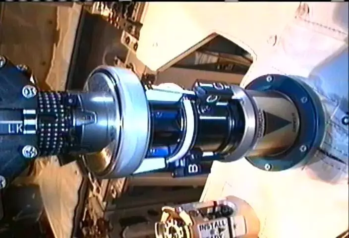 Dextre and the Multifunction Tool carefully position the Tertiary Cap Adapter over the Tertiary Cap Receptacle on the RRM module (Image: NASA/CSA)