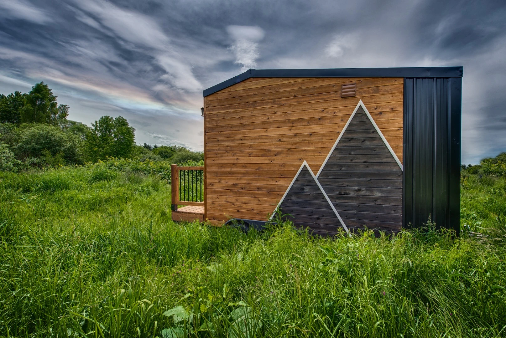 The Acorn is finished in tongue and groove and cedar, with corrugated metal accenting,