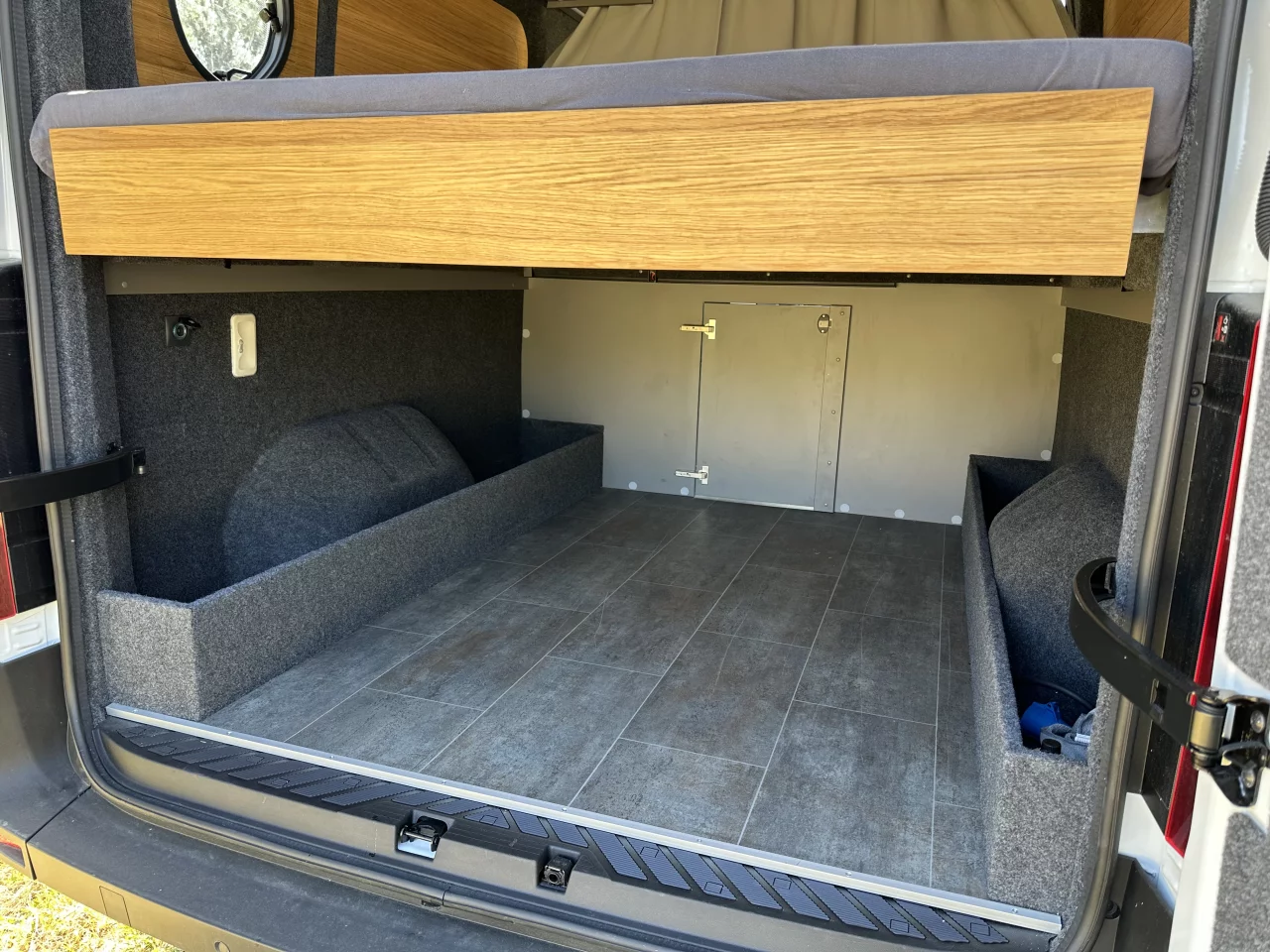 Nissan says the Interstar-e camper van offers nearly 2.6 cu m of storage space, and this garage is ready for luggage, camping equipment and sports gear
