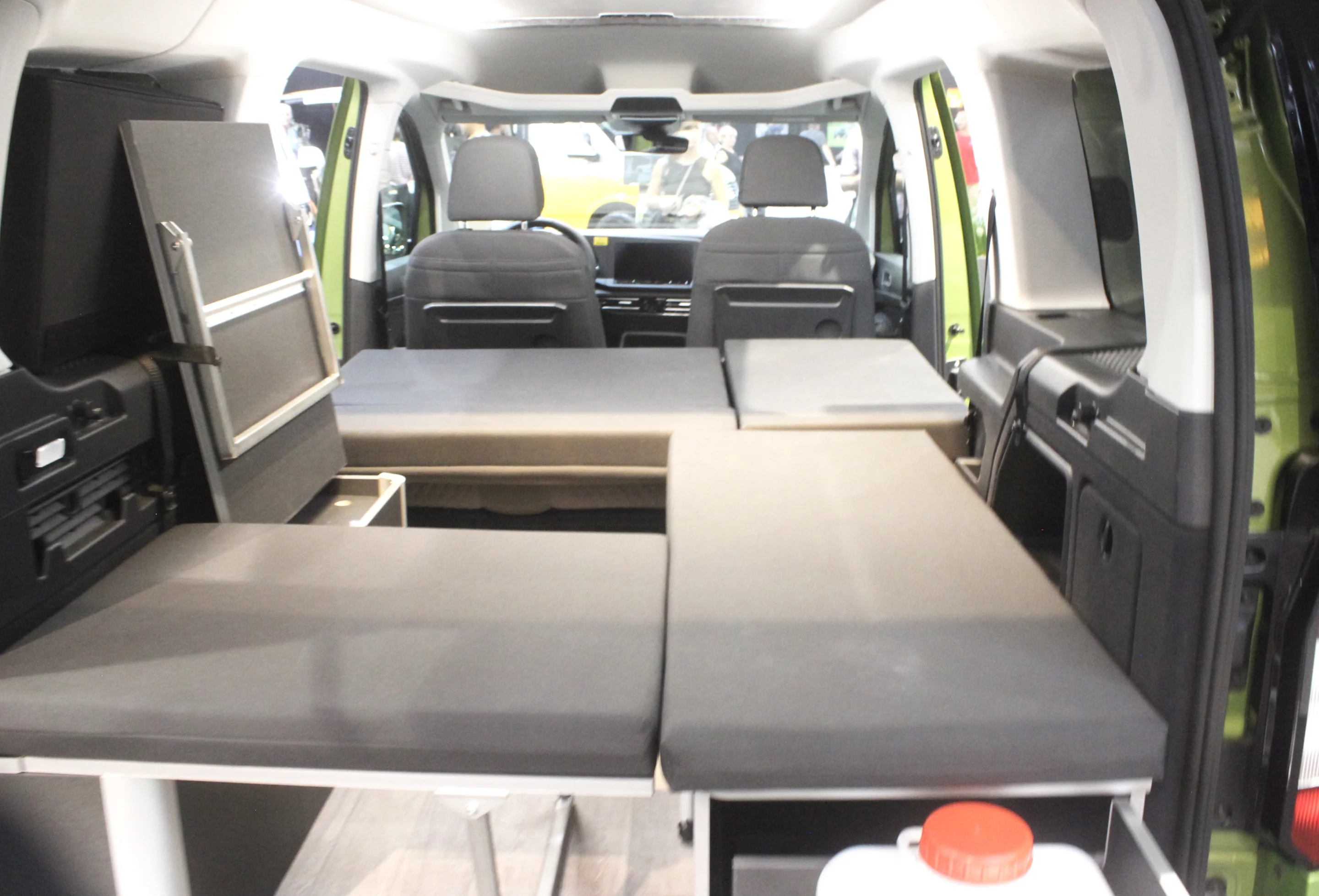 The cushions are a bit of a mess here, but line them up, drop that last section and you have a double bed