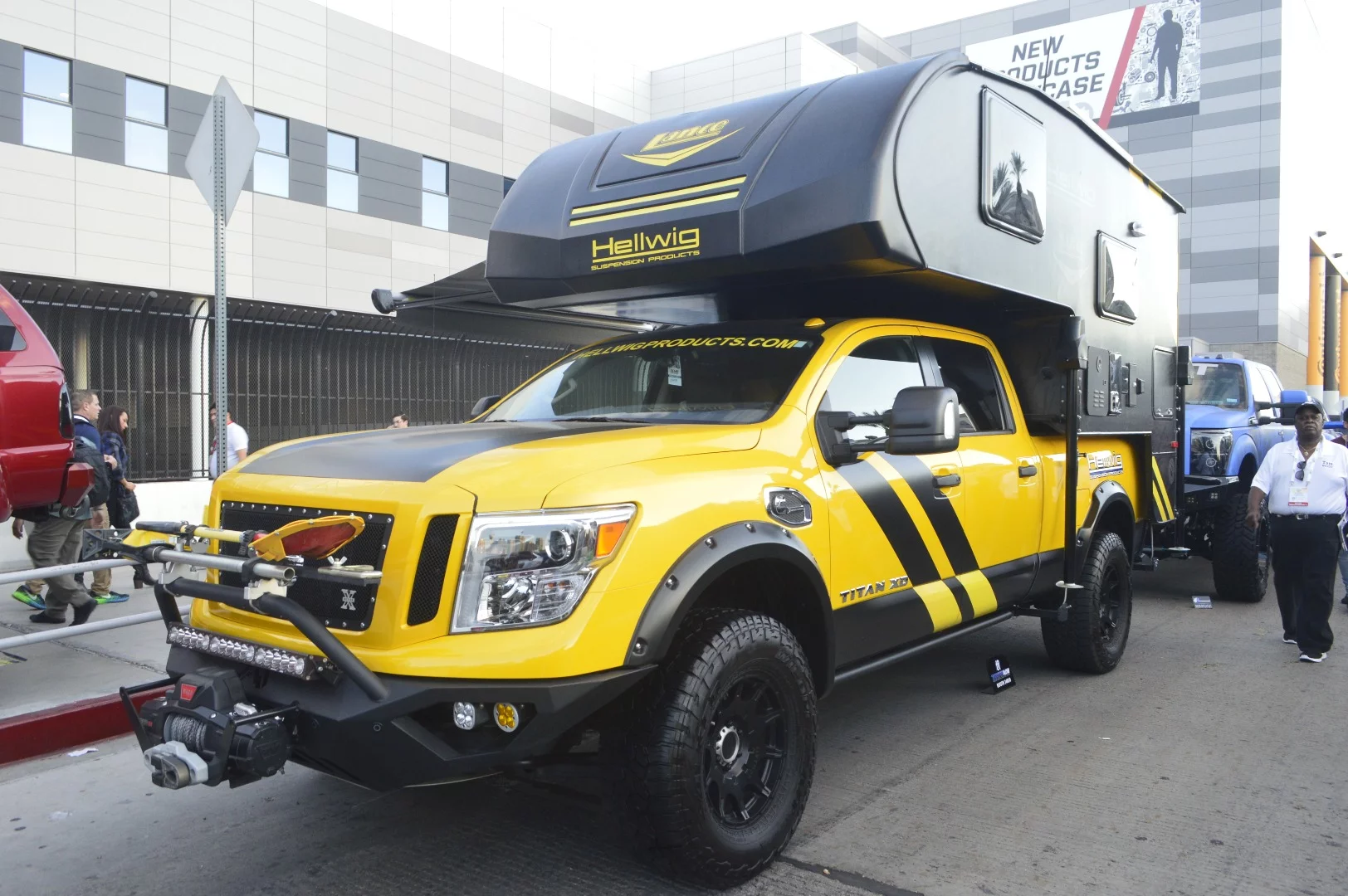 A Lance camper and raft of accessories turn the Titan XD into a full overland camper