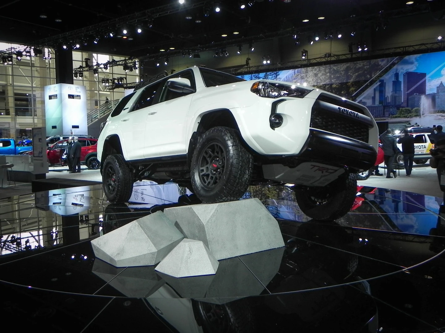 Up on blocks, the 4Runner TRD Pro shows off its articulation, courtesy of improved springs, upgraded shocks, and more room underneath