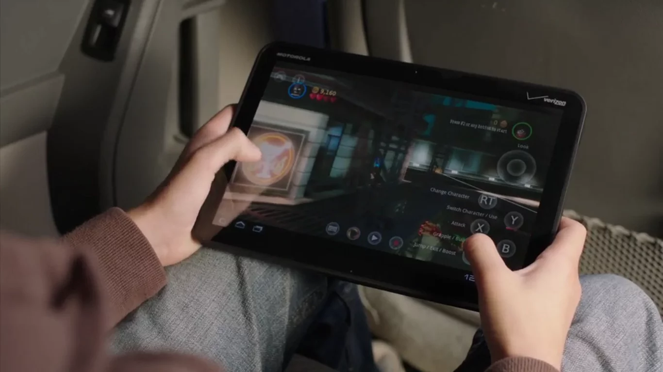 OnLive player control the action using on-screen touch controls or with OnLive's wireless controller