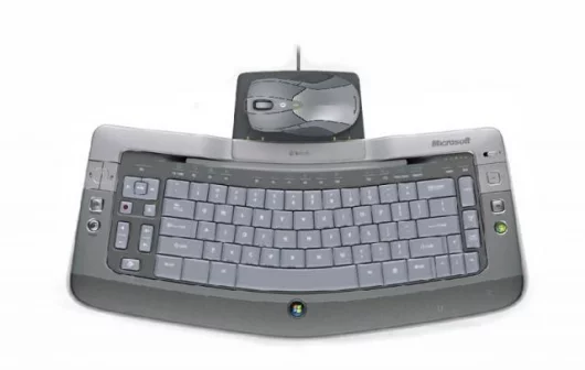 The docking station for the recharging of the mouse plugs into the back of the keyboard to facilitate recharging