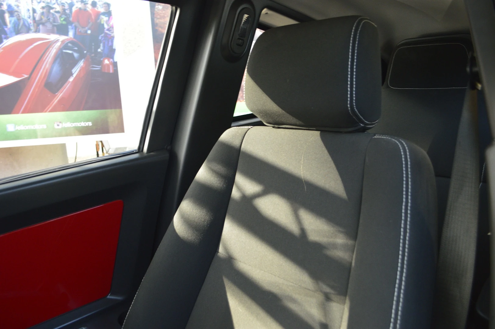 The Elio seats two people, one behind the other