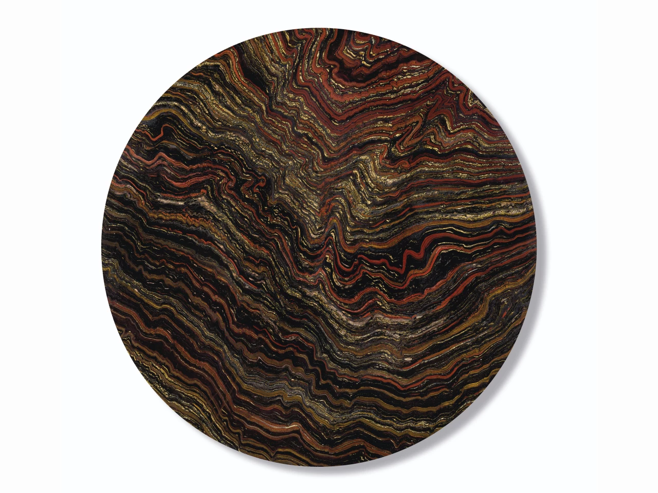 33-inch diameter "table top" 2.5cm thick specimen of banded layers of hematite, jasper and chatoyant Tiger-eye from the Paleoproterozoic (2.5 to 1.6 billion years ago) | Sold for: $12,997 (£10,000) by Christie's on October 28, 2020