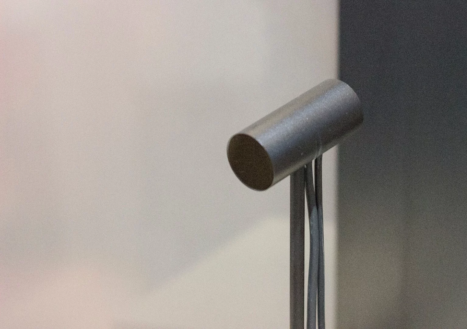 The lone motion sensor, that you'll prop on your desk (or mount on the wall)