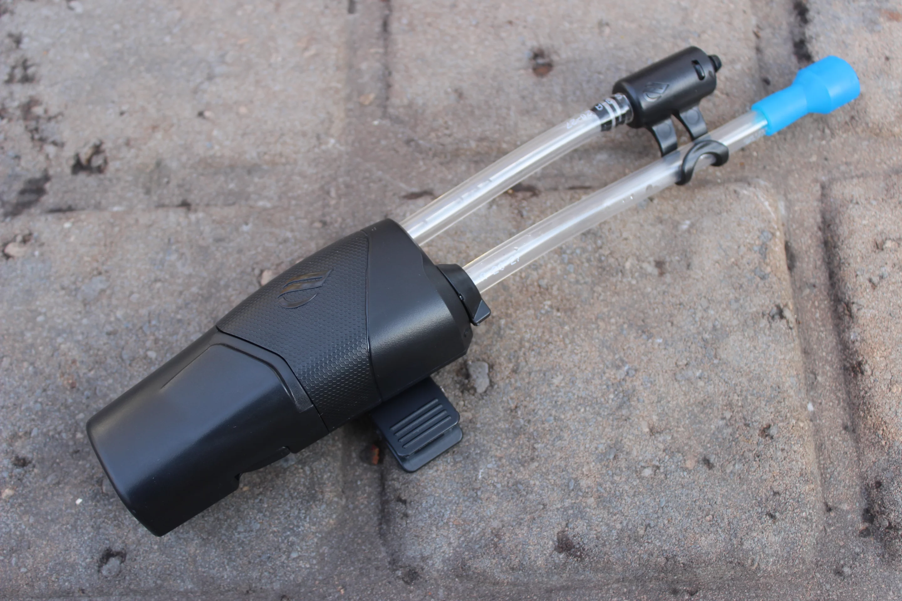 The Hydro gets clipped to the shoulder strap of the user's hydration pack