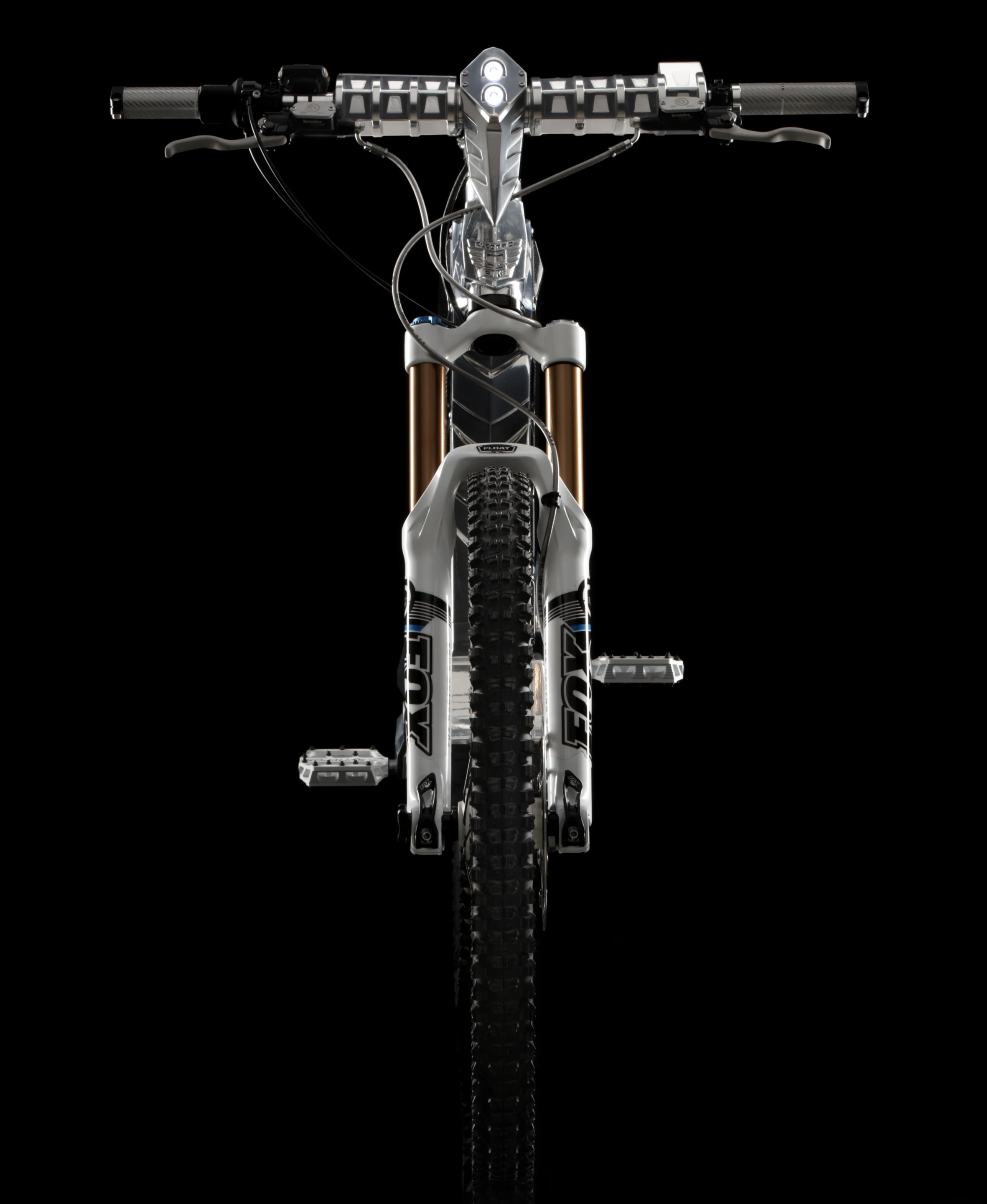 Front view of the Beast showing the built-in LED headlight, Fox suspension and one piece handlebar and stem