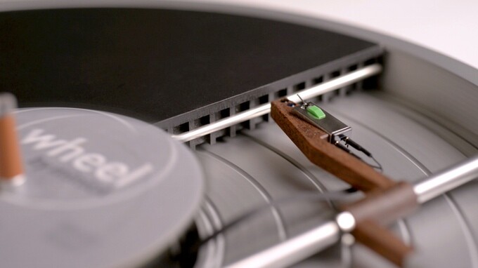 The rosewood linear tonearm is mounted within the Wheel's platter