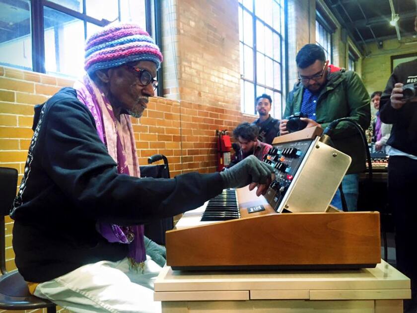 Founding member of Parliament-Funkadelic Bernie Worrell tries a new Minimoog Model D for size at the Moog Pop-Up Factory at Moogfest 2016