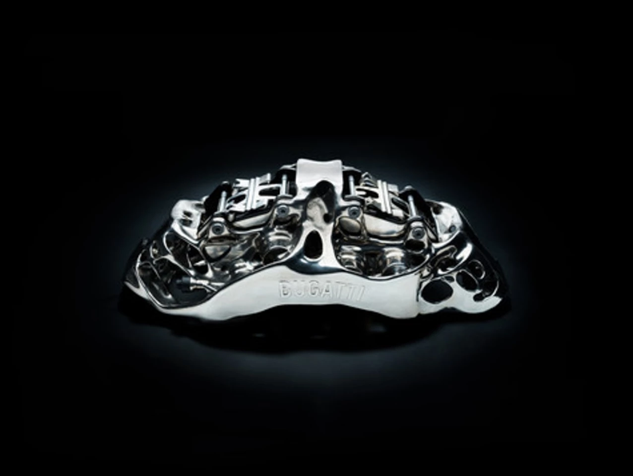 This brake caliper is the largest functional titanium automotive component produced by 3-D printing in the world