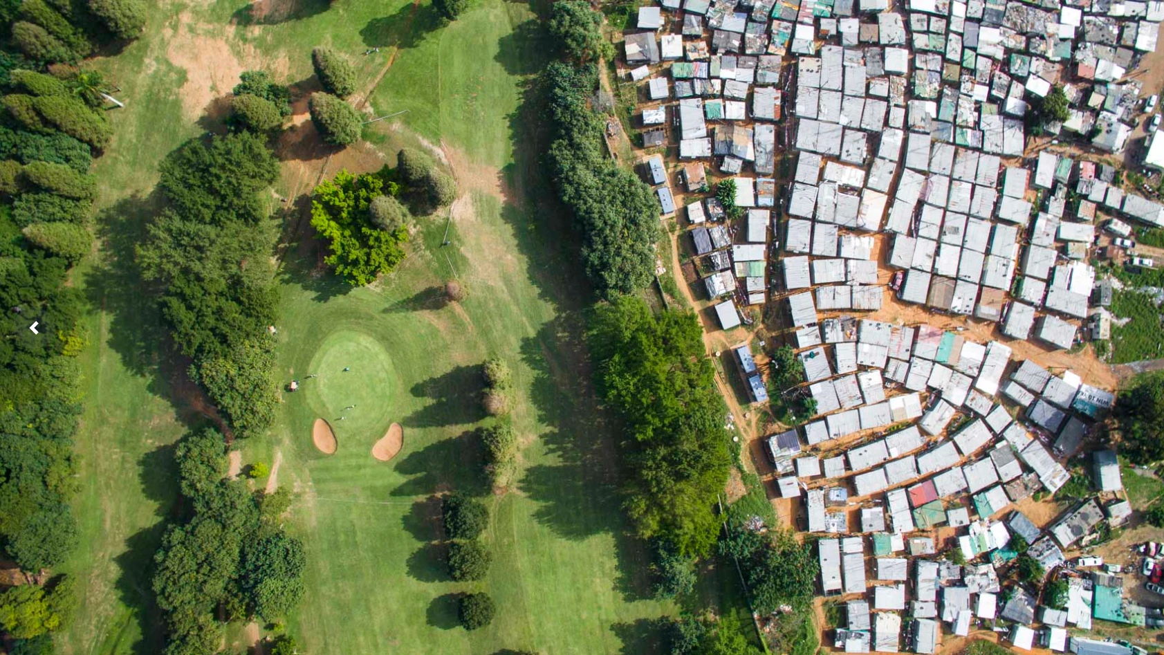 A low-income settlement alongside the Papwa Sewgolum Golf Course in Durban, South Africa