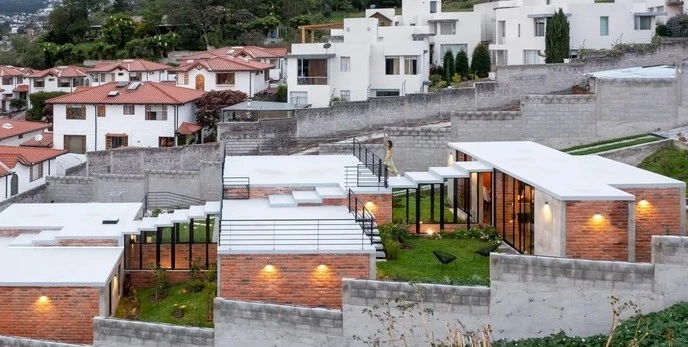 Ecuadorian architectural firm El Sindicato has recently created a unique family home built into a slope