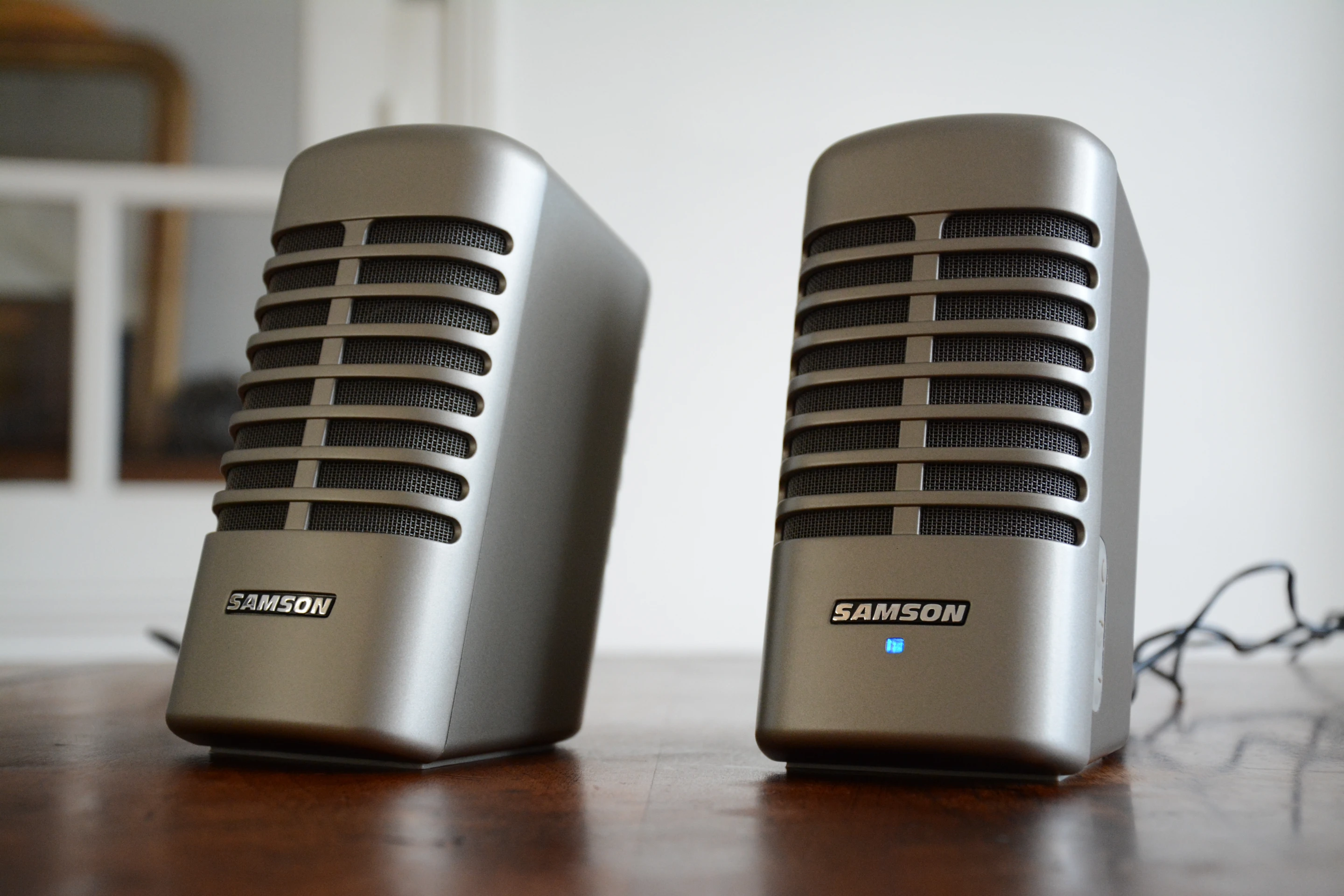 The Meteor M2s look rather like a pair of old Shure or Stromberg-Carlson type microphones sitting on the office desk, but they throw out audio instead of capturing it (Photo: Paul Ridden/Gizmag)