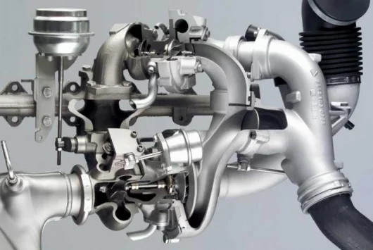 Complex plumbing on BMW's variable twin turbo diesel engine that won the 3 litre class