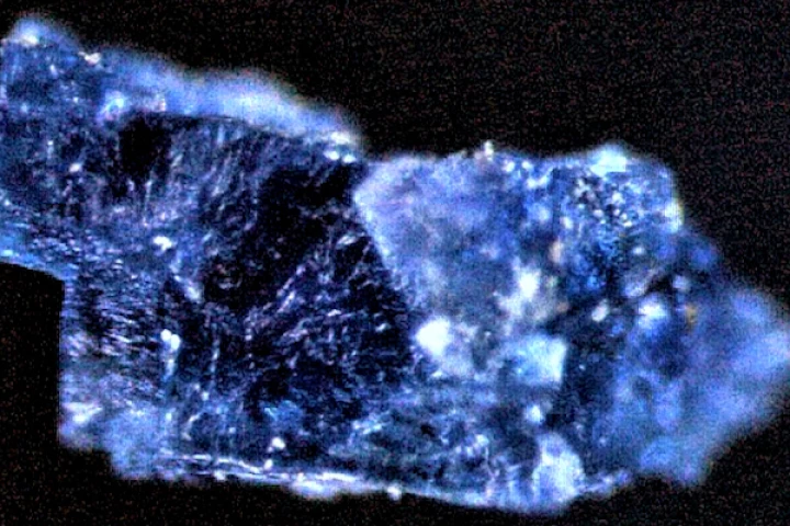 A tiny blue crystal containing organic compounds, taken from one of the meteorites