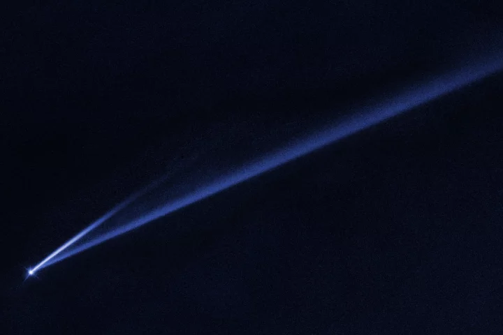 A Hubble Space Telescope image revealing the gradual self-destruction of an asteroid, whose ejected dusty material has formed two long, thin, comet-like tails
