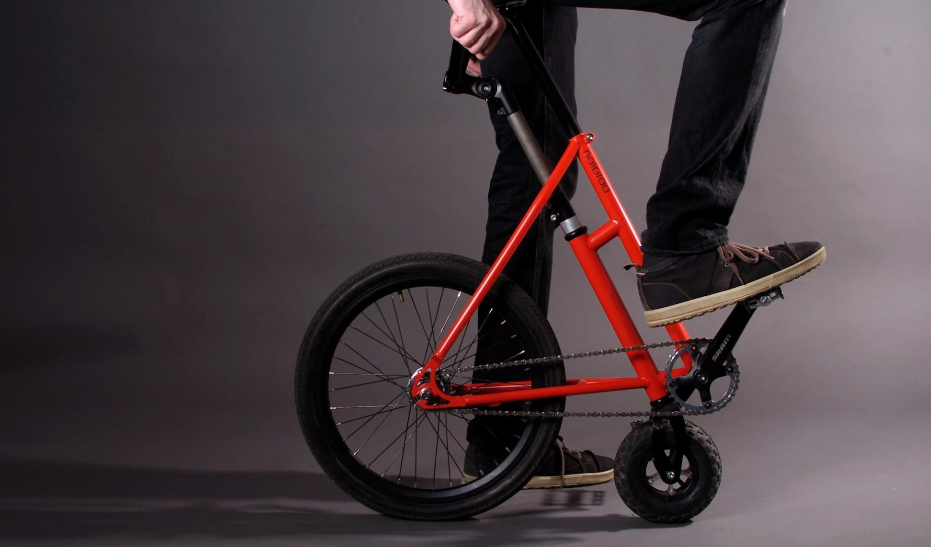 Two wheels, pedals, a saddle and half a frame
