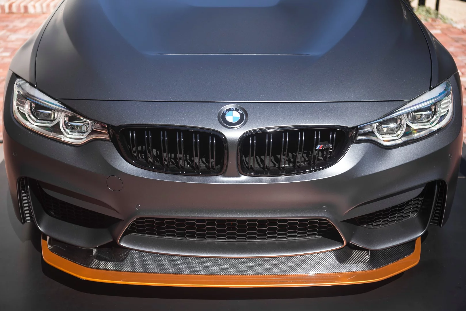 The Concept M4 GTS front splitter is highlighted in Acid Orange