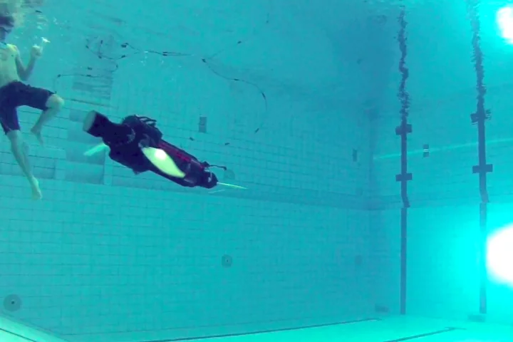 A robot sea turtle built to explore fin-based propulsion takes its first dip in the pool